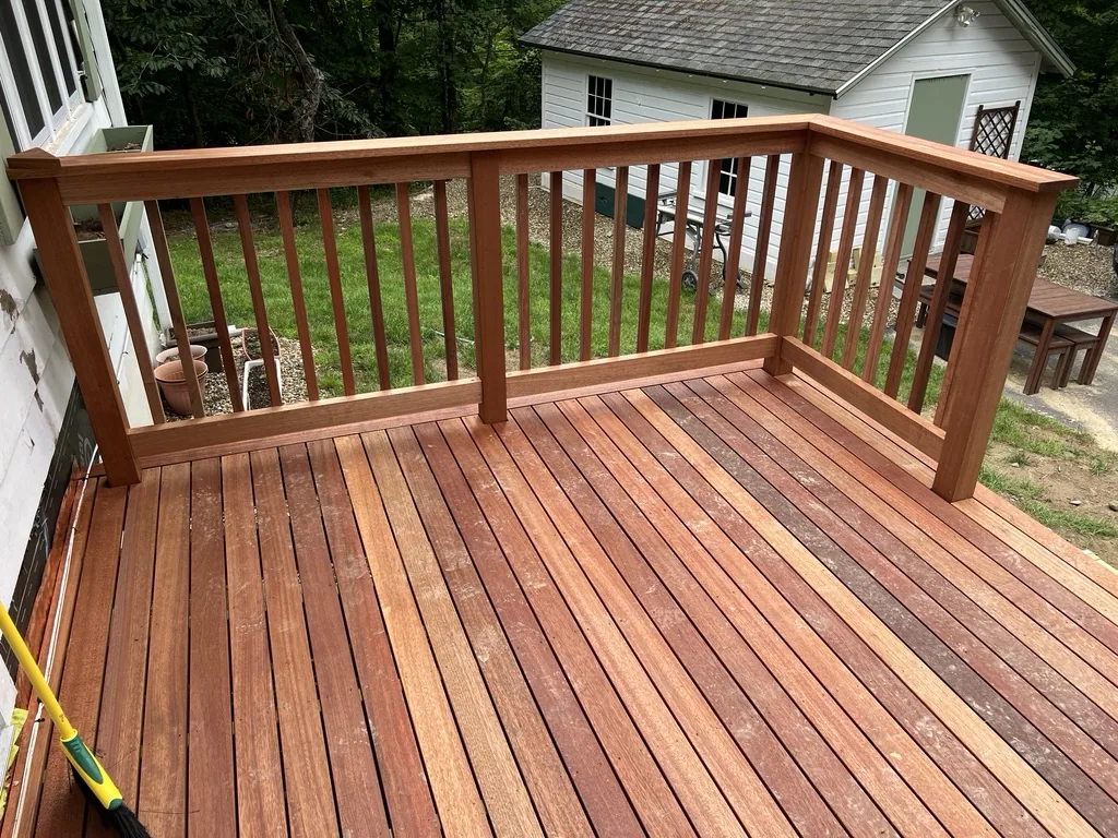 Finished mahogany deck with railing in rich oiled tones